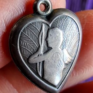 Antique sterling silver puffed heart charm